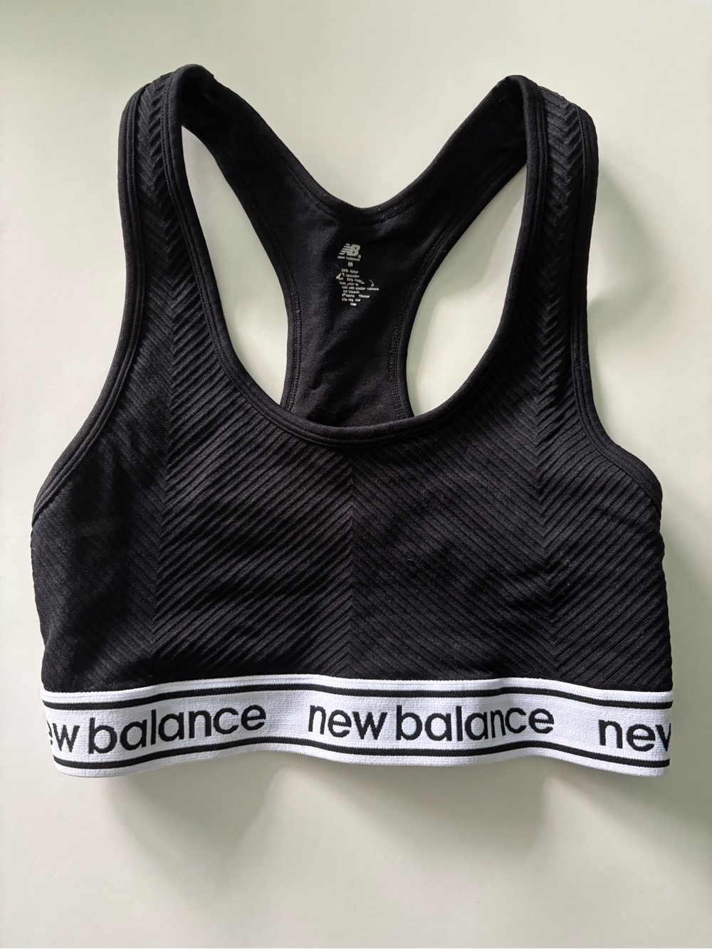 New Balance Black Racerback Sports Bra with White Logo Band